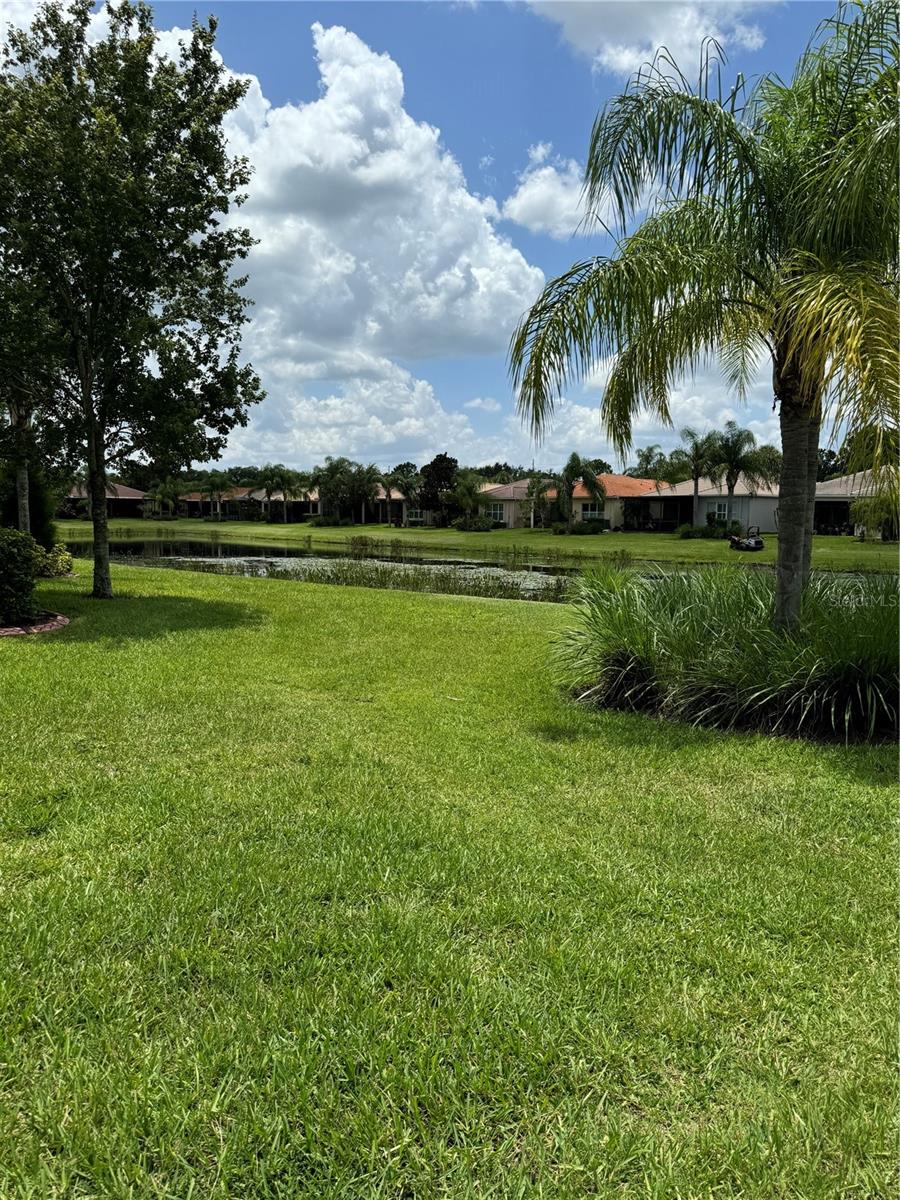 VERY PRIVATE YARD WITH MORE THAN A PEEK OF THE POND.