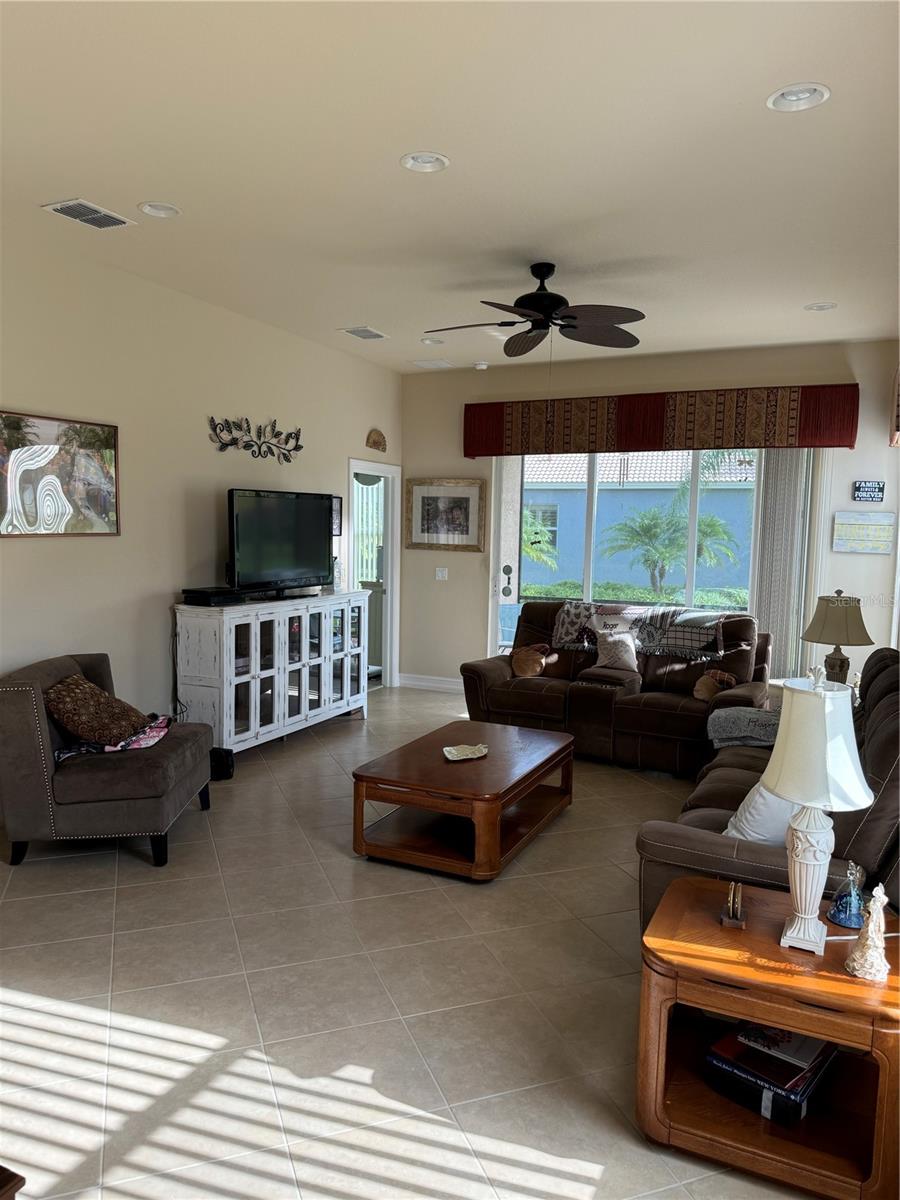 LIVING ROOM... SPACIOUS, LIGHT & BRIGHT! POCKET DOOR SLIDERS LEAD TO LANAI