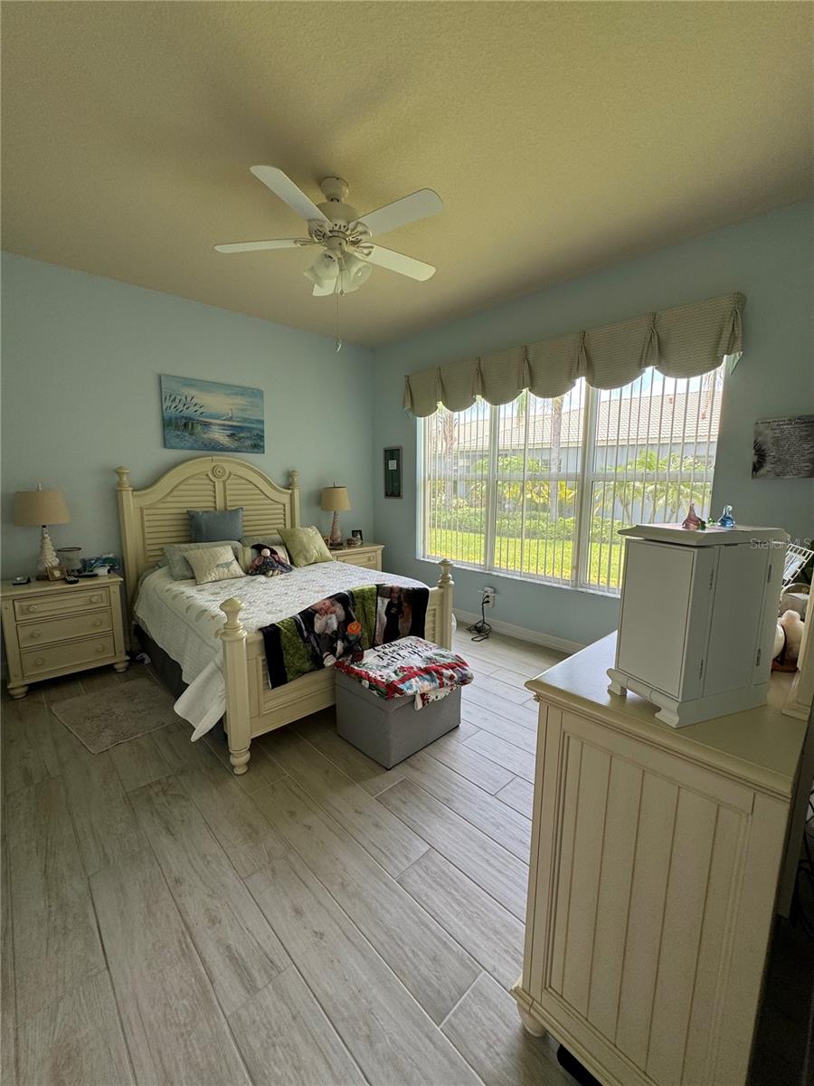 LARGE MAIN BEDROOM WITH PORCELAIN TILE FLOORING