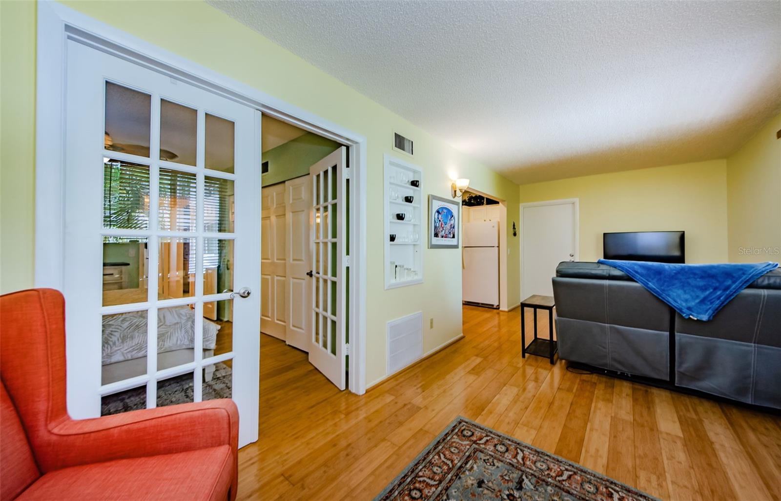 Flex space with French doors to primary bedroom