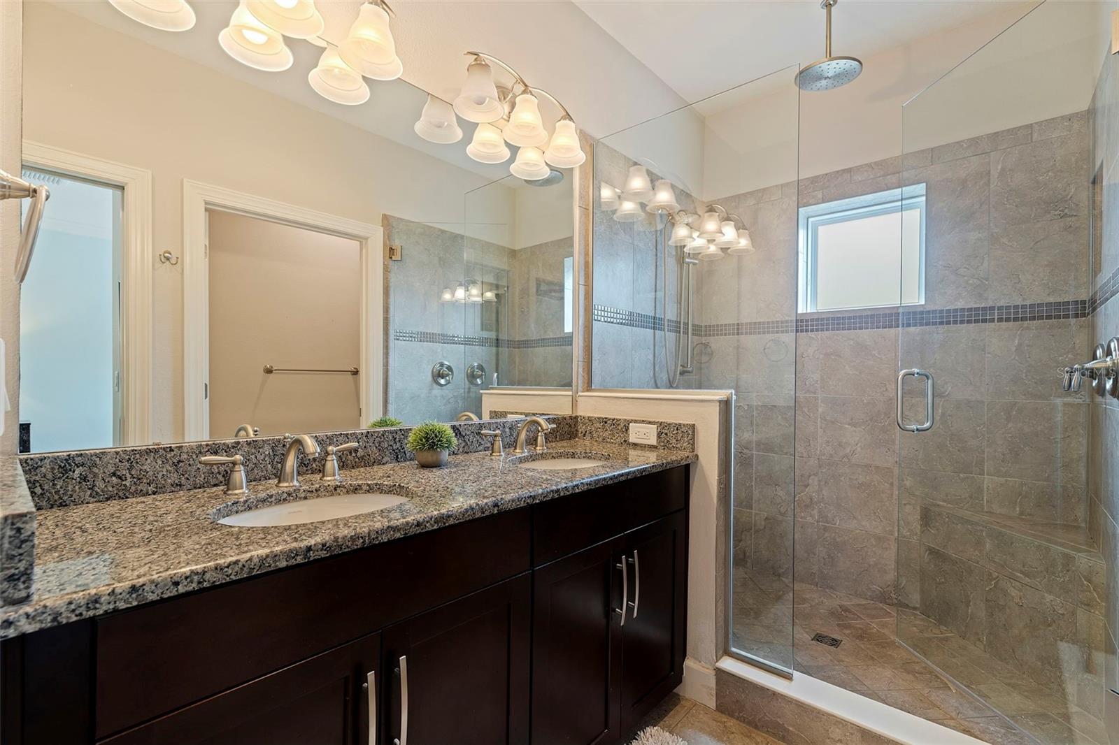 Master bath with walk in shower and dual sinks