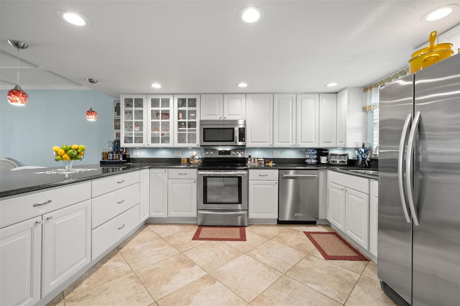 Wide kitchen area. Recessed lighting.