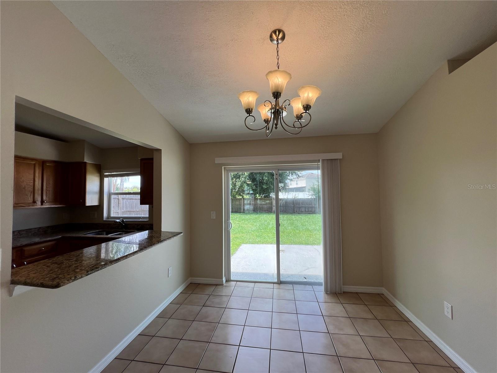 dining area with sliding doors to backyard