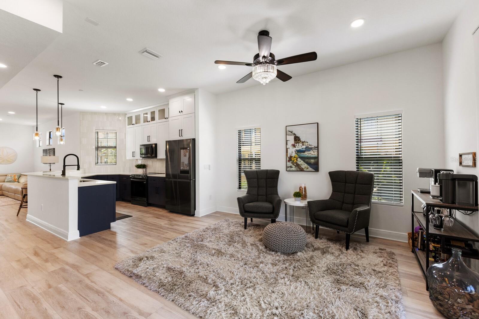 Living room off kitchen open to 2nd floor balcony