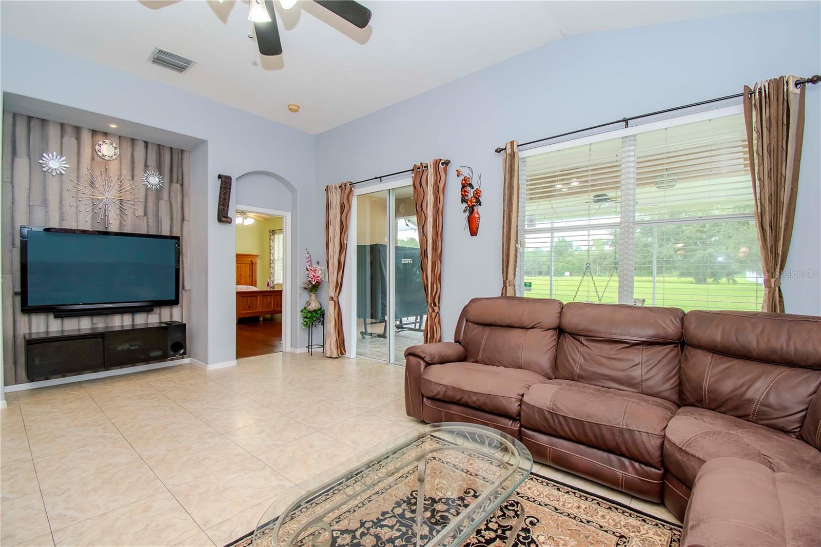 Living room, back patio, primary bedroom