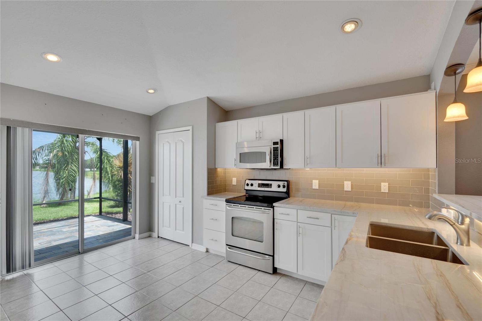 Beautiful Kitchen! And check out the view through the sliding glass doors!