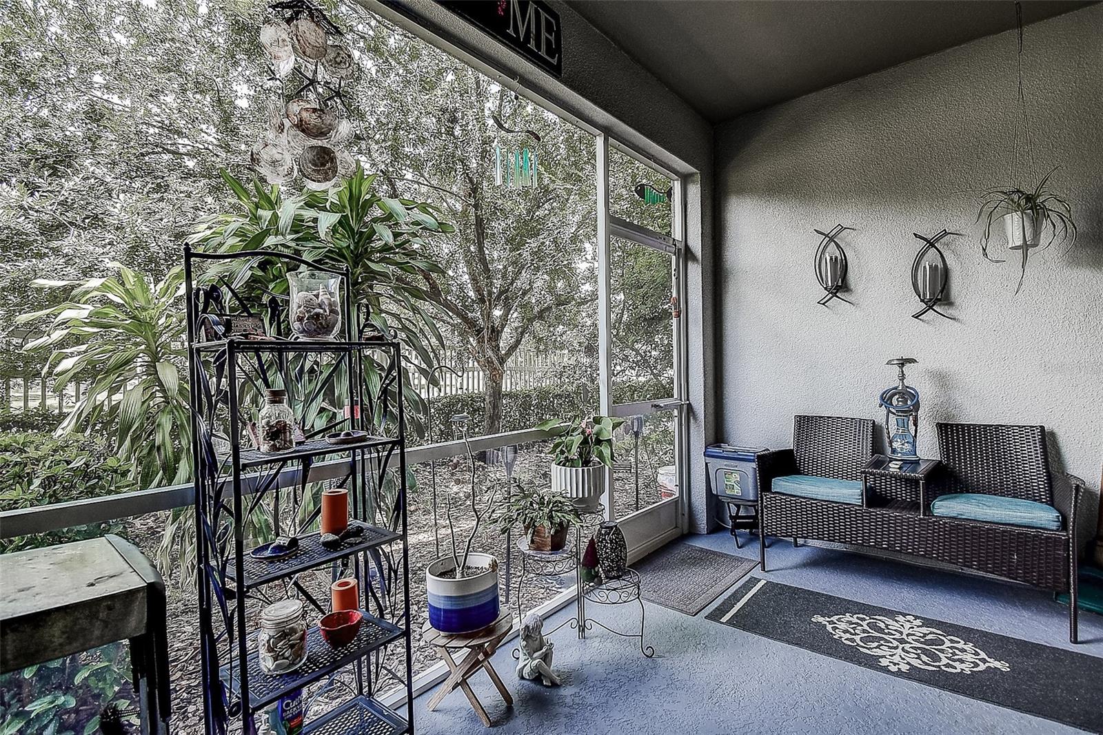 Screened porch with water and sanctuary views.