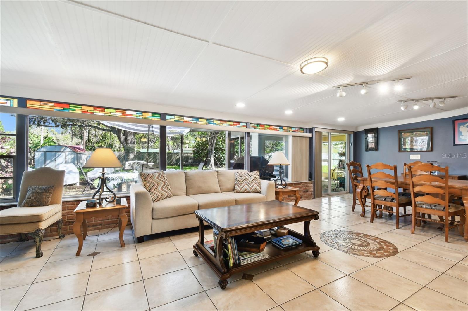 Sliders to the right, into the enclosed porch (laundry room in porch area)