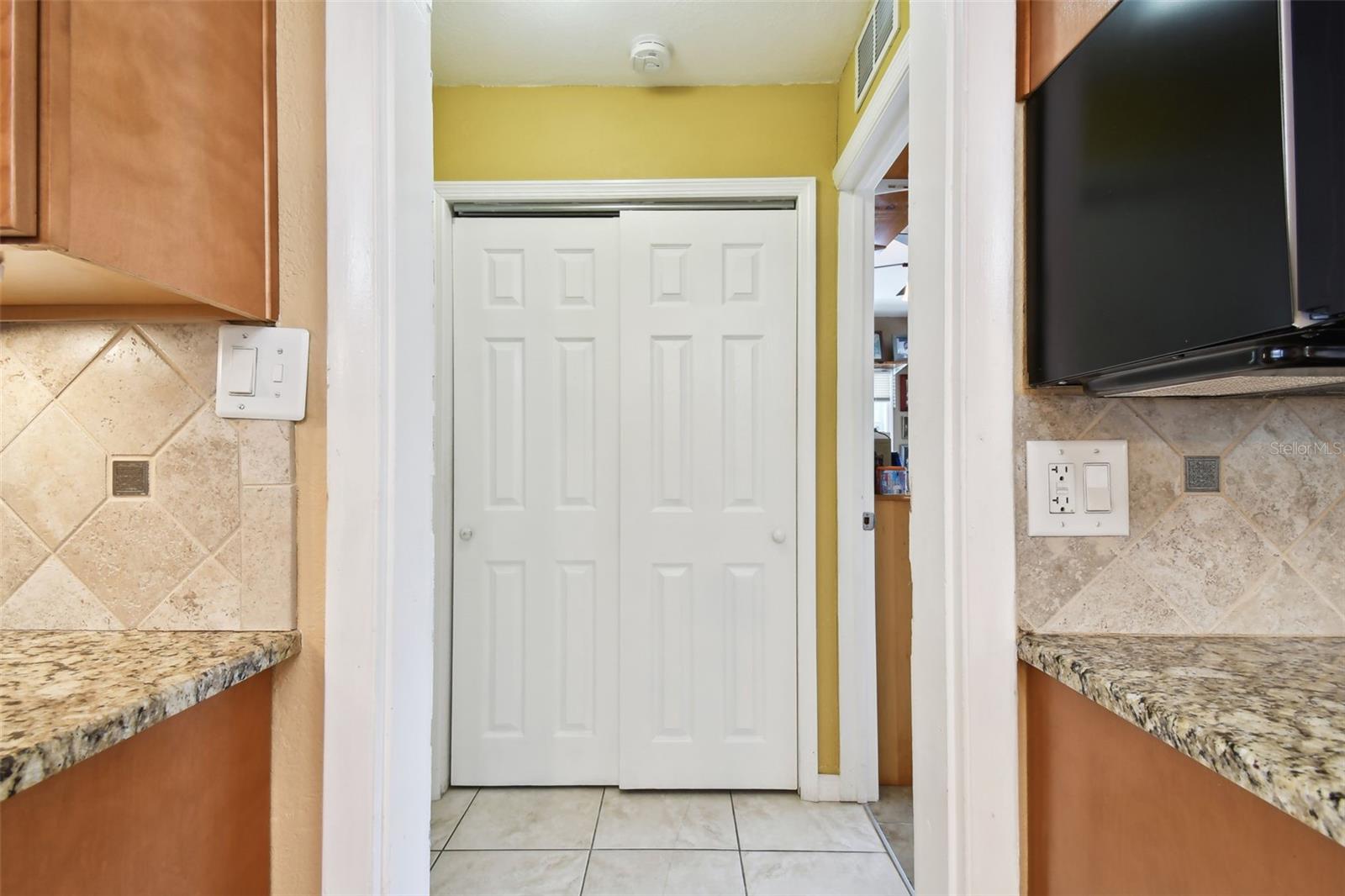 Leading to 2 bedrooms next to the kitchen area.