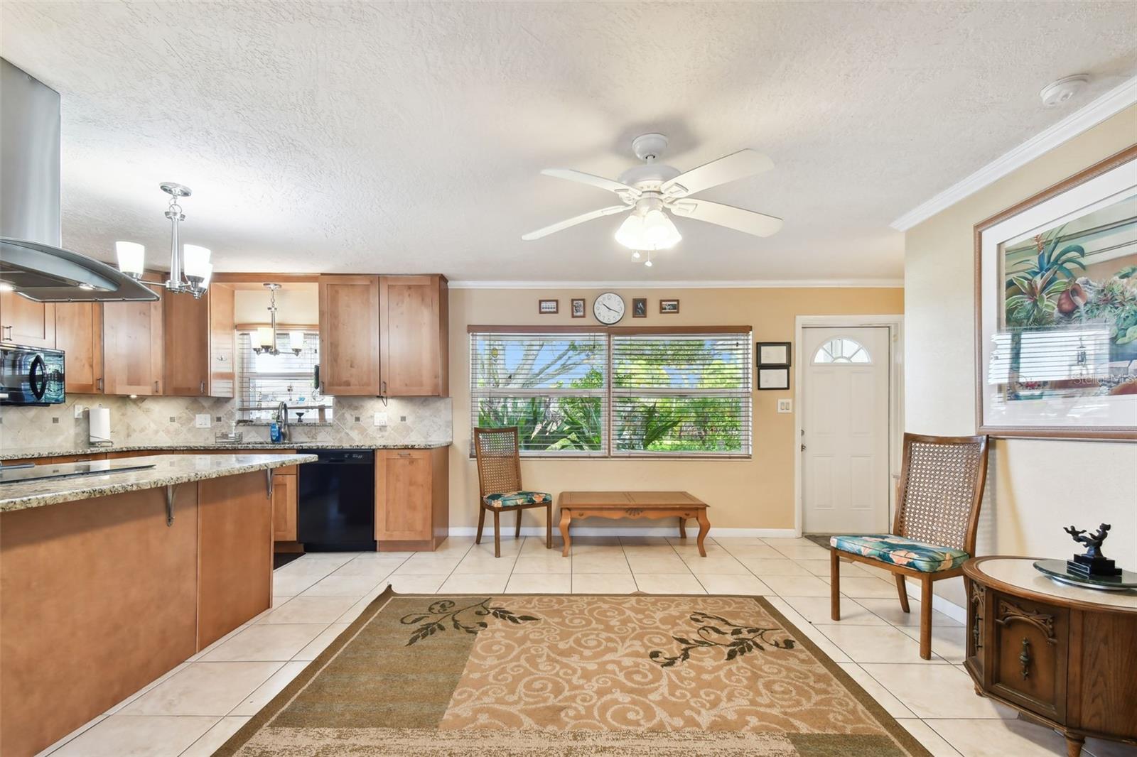 Living room/kitchen combo. Tiled floors throughout