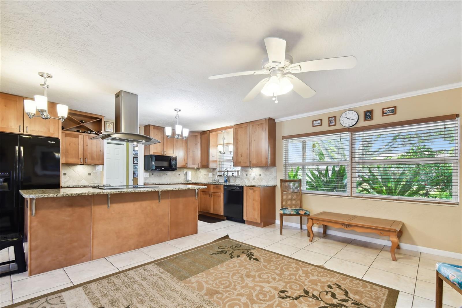 Remodeled kitchen with granite counters, soft-close wood cabinets and drawers. Great lighting