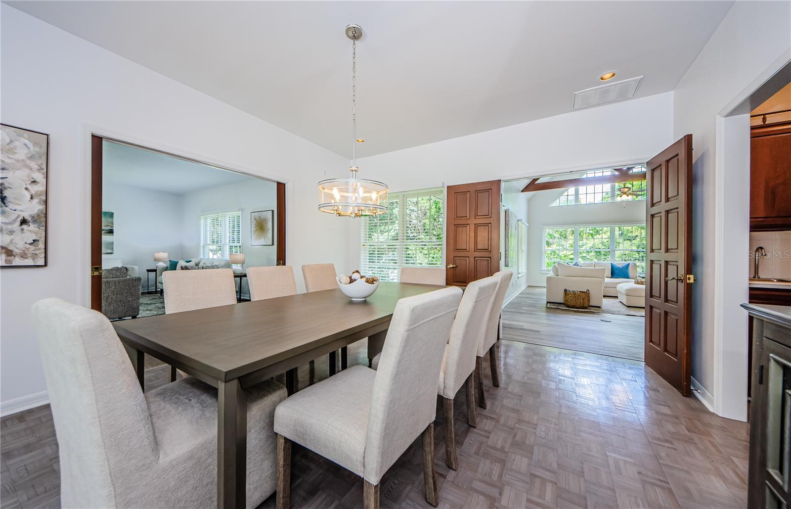 The dining room can be reached from 4 different directions, the living room, the foyer, the family room and the Butler's Pantry.