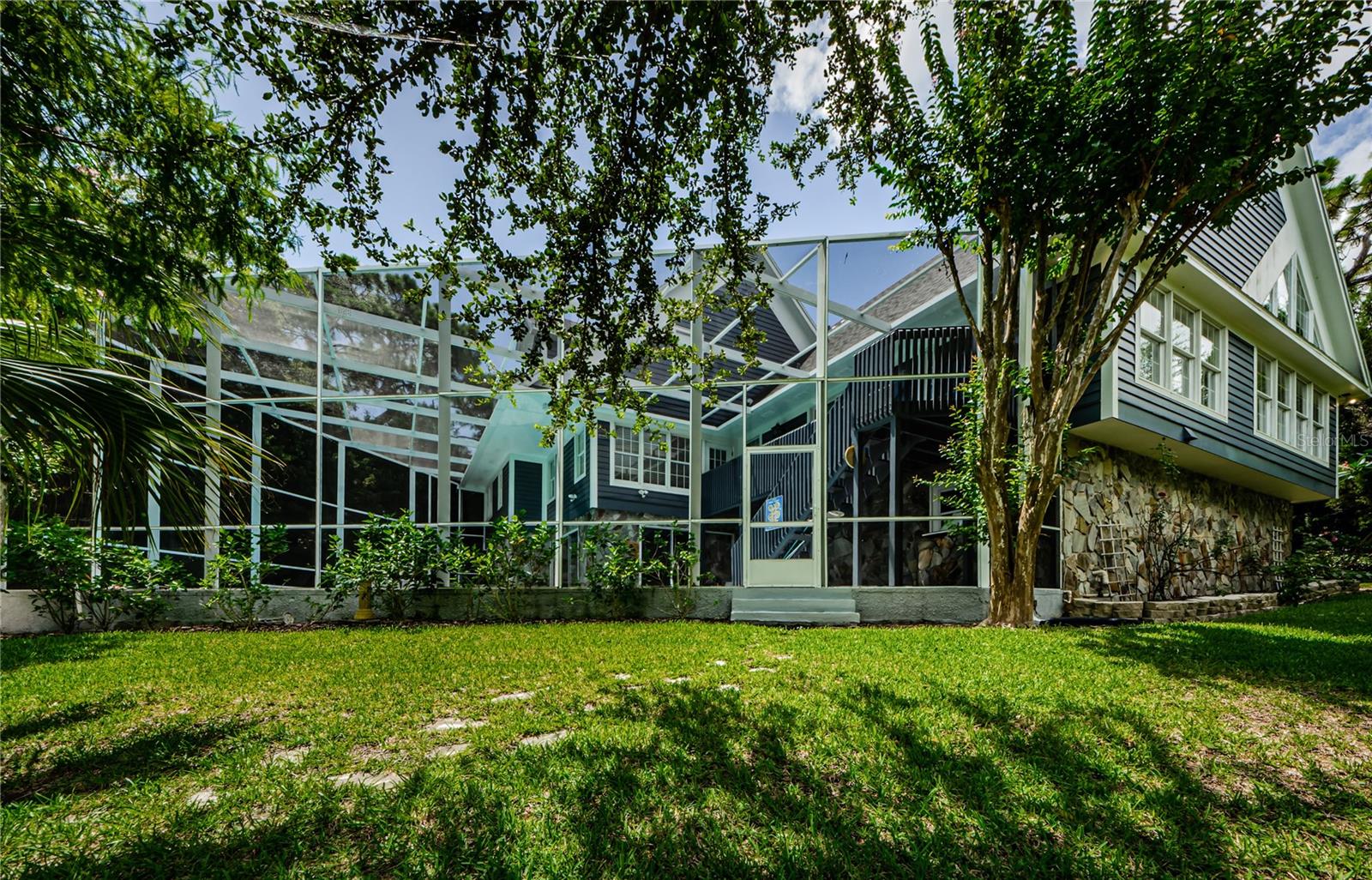 Look at the back of this three story beauty with the pool looking gracefully over Curlew Creek.