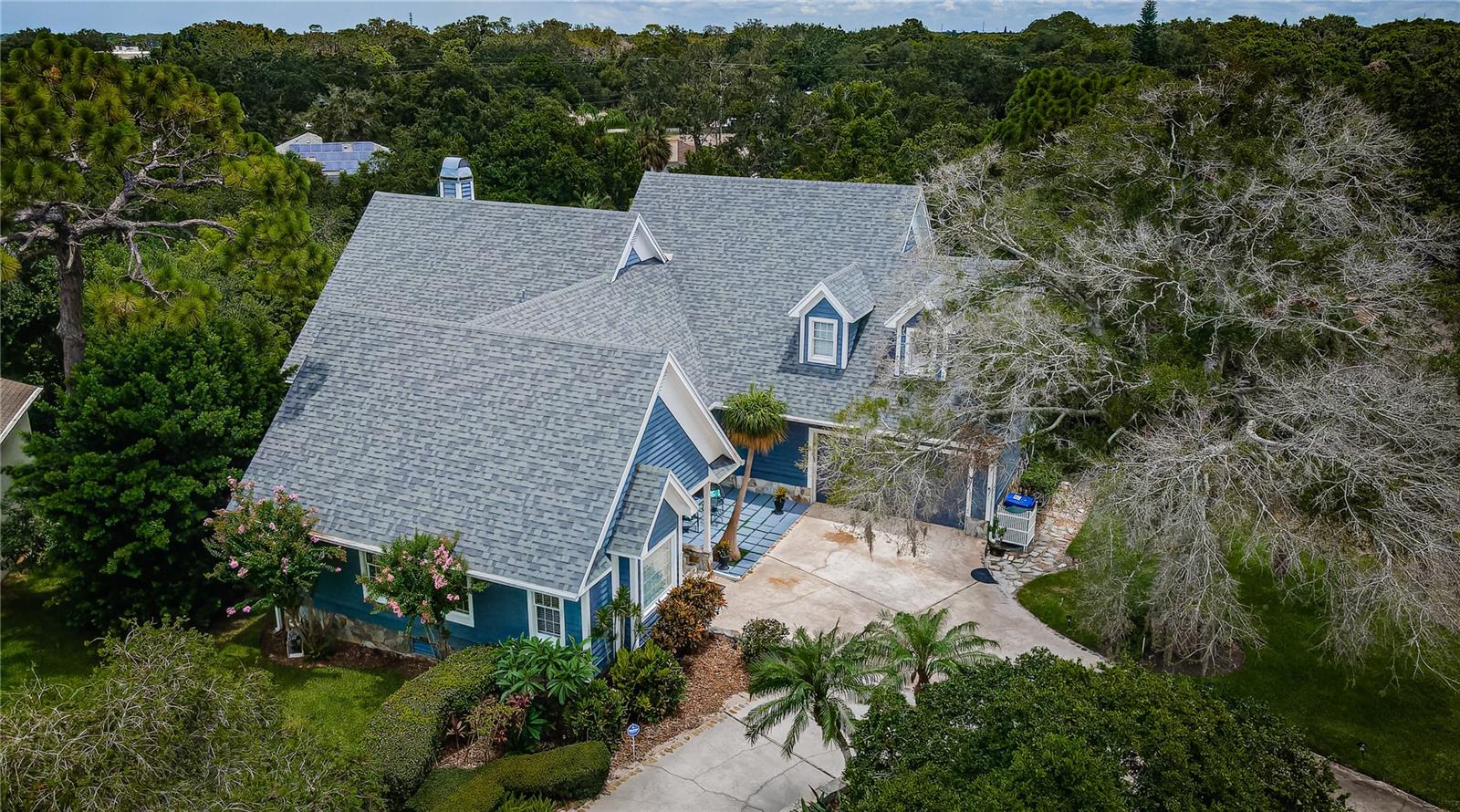 Overhead view of the Cape Cod home with the bay in the background.