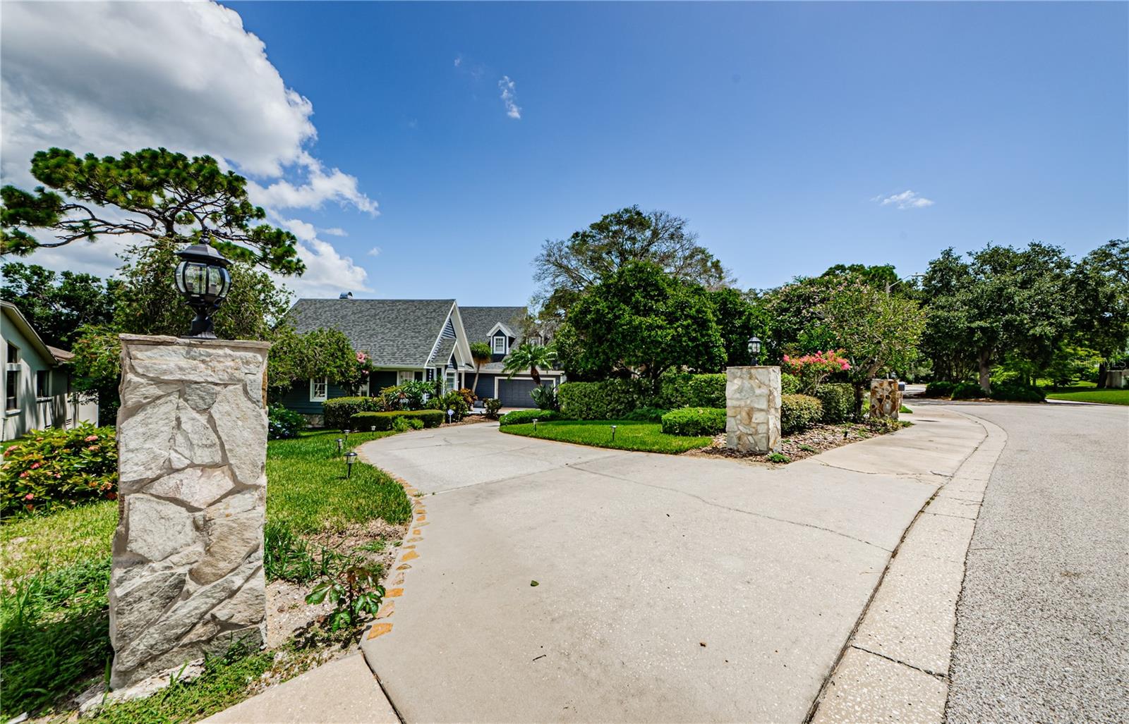 Entrance on West side to 1142 Weybridge Lane.  Lanterns are very pretty at night along with new Malibu's.