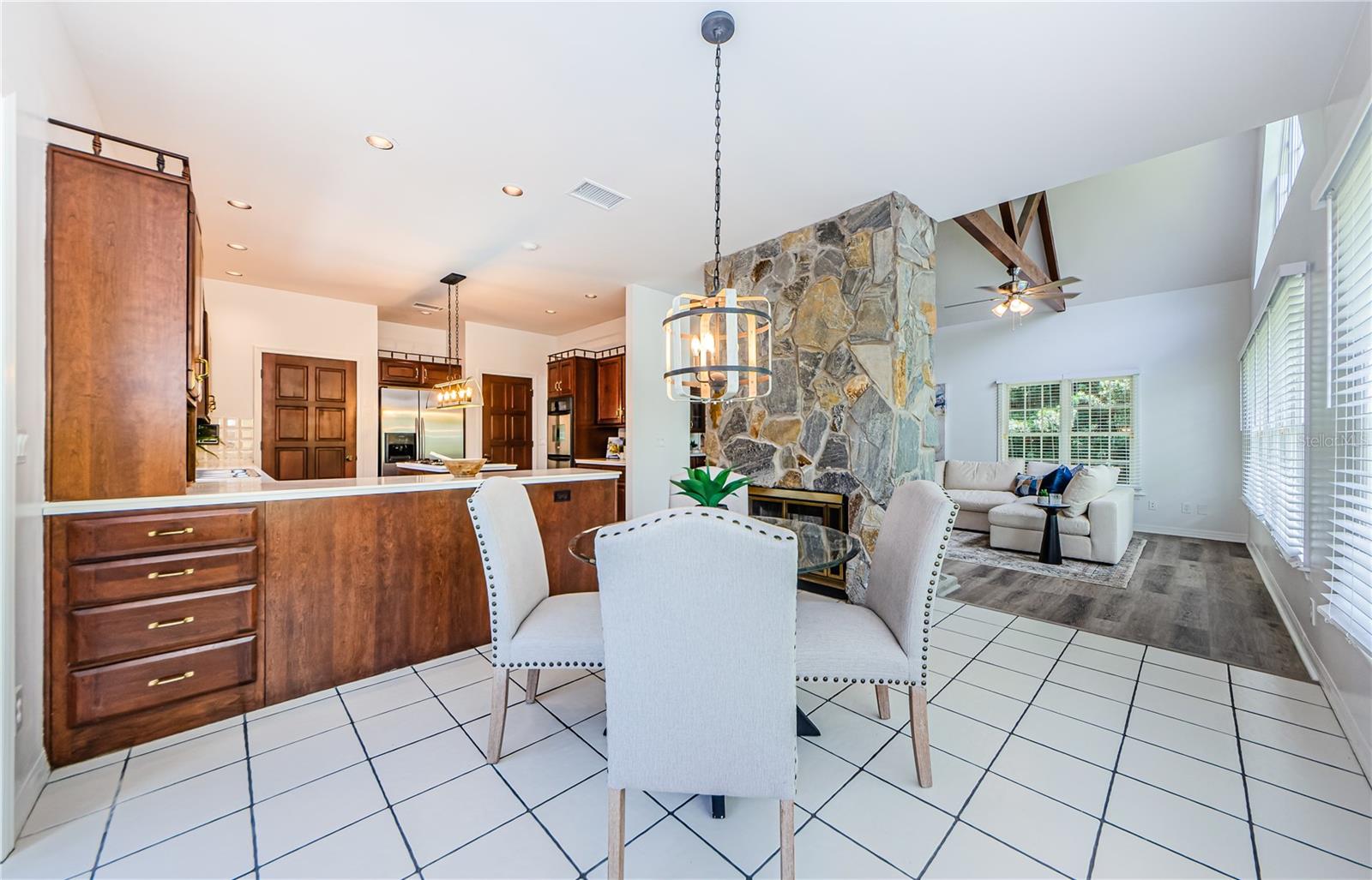 Cozy kitchenette for breakfast, lunch and dinners.  Get the benefit of the two-sided stone fireplace in cooler weather.