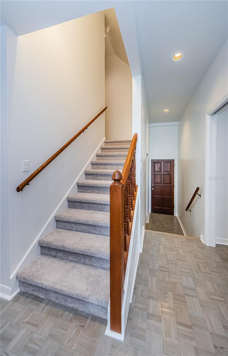 Stairs going to upper level consisting of 3 bedrooms and 2 full baths.  Starting at the bottom of the stairs and upper level has complete new carpeting and padding.