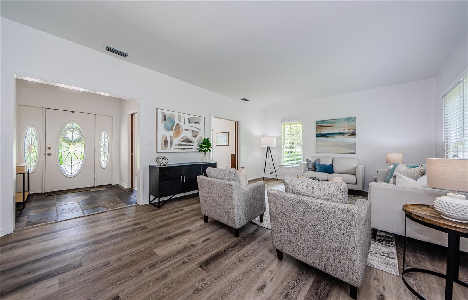 The formal living room is the first room you will enter with windows everywhere letting in plenty of light.  Freshly painted throughout, this home is move-in ready!