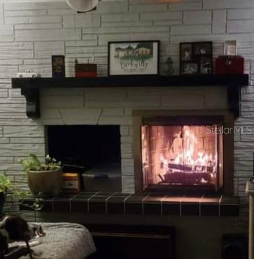 Wood burning fireplace with log storage