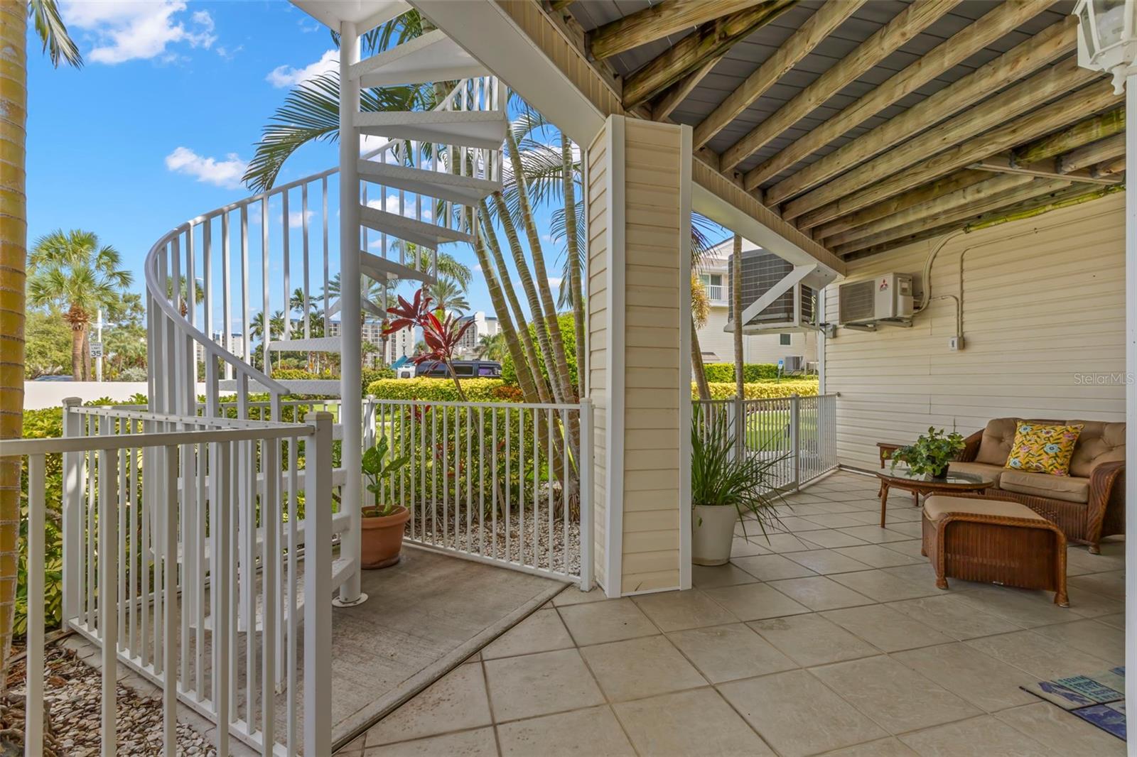 First Floor Patio with Path to the Pools and Docks