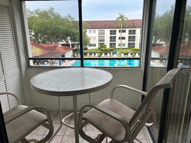 Private patio off master bedroom with view of pool