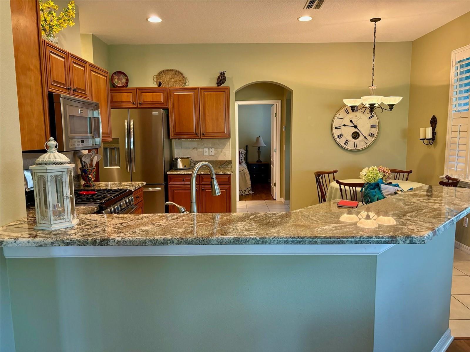 Kitchen and dining area and guest bedrooms entryway