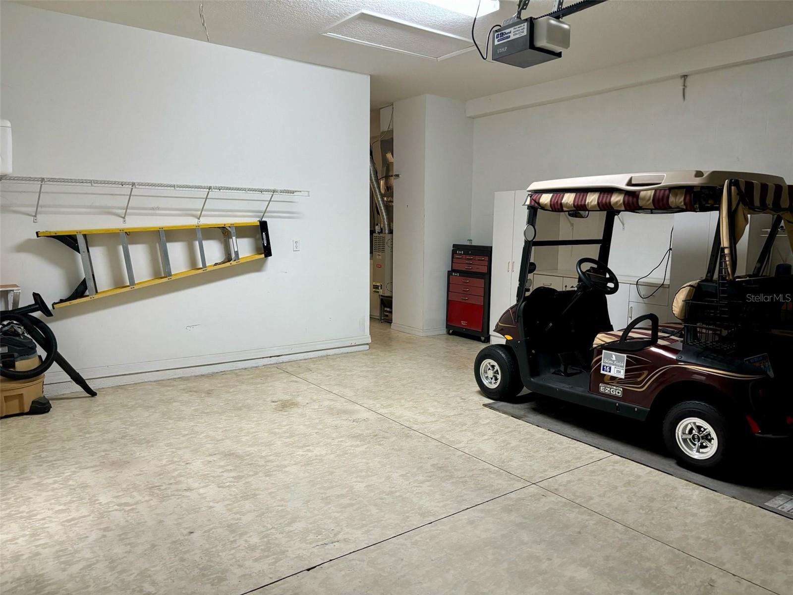 2-car garage with ladder and golf cart