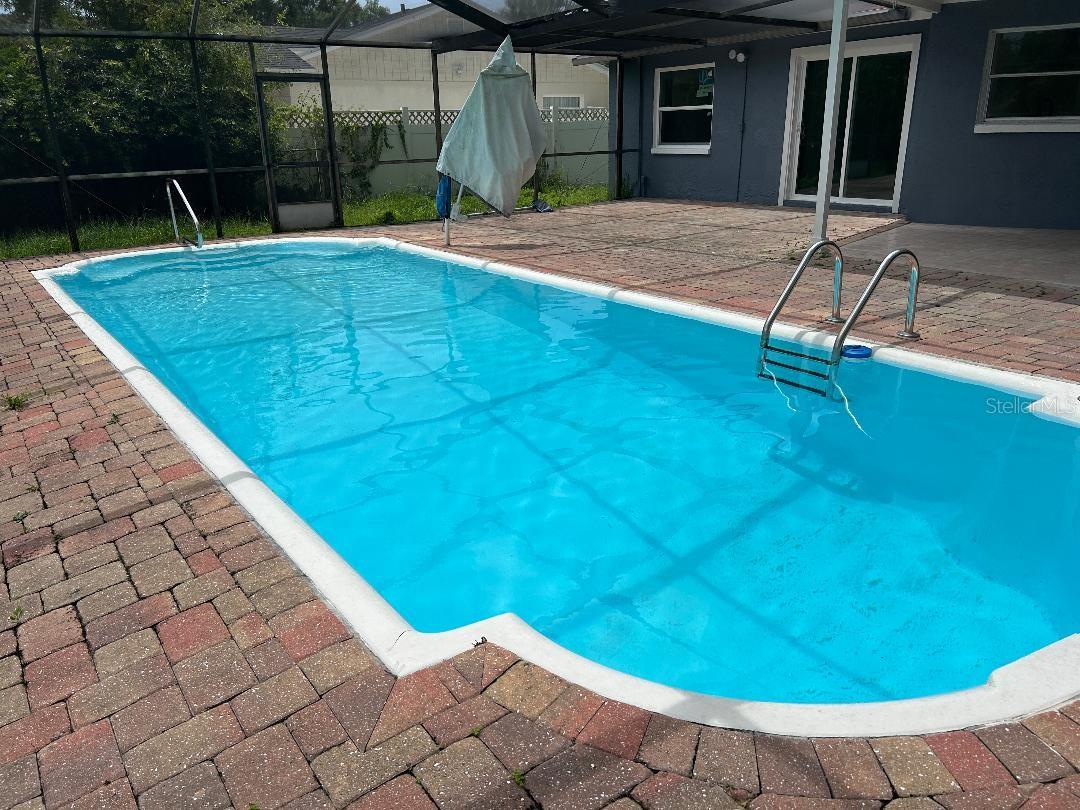 Opposite view of pool facing house