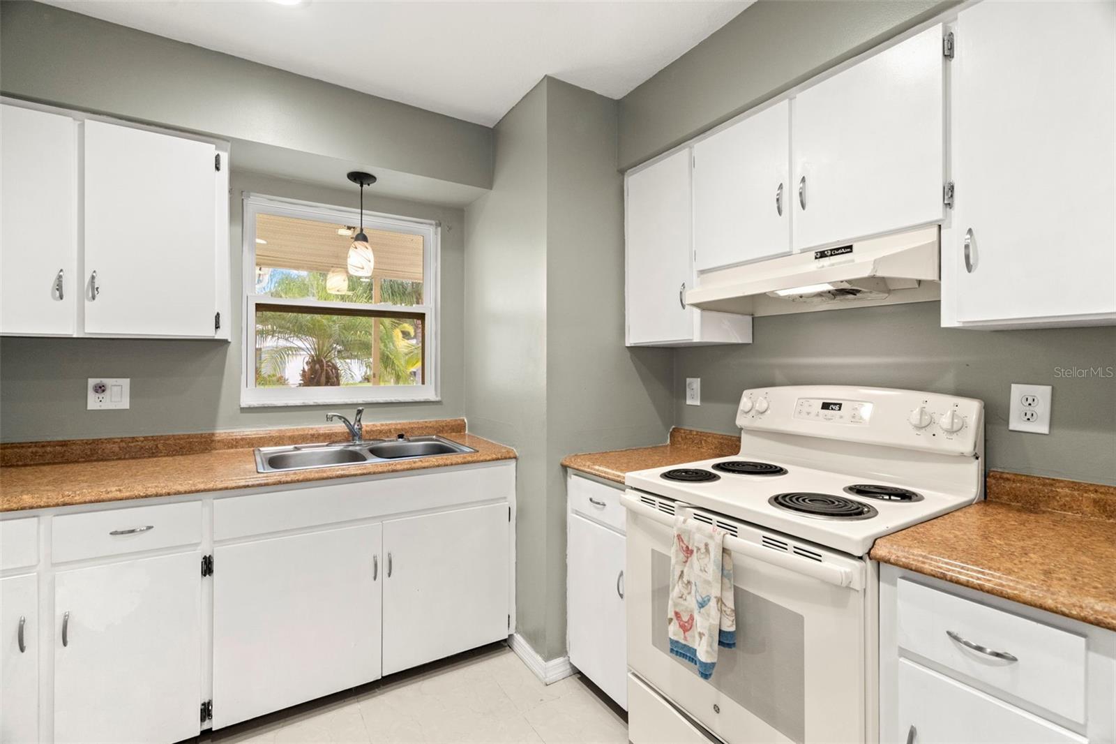 The kitchen window looks out to the front of the home