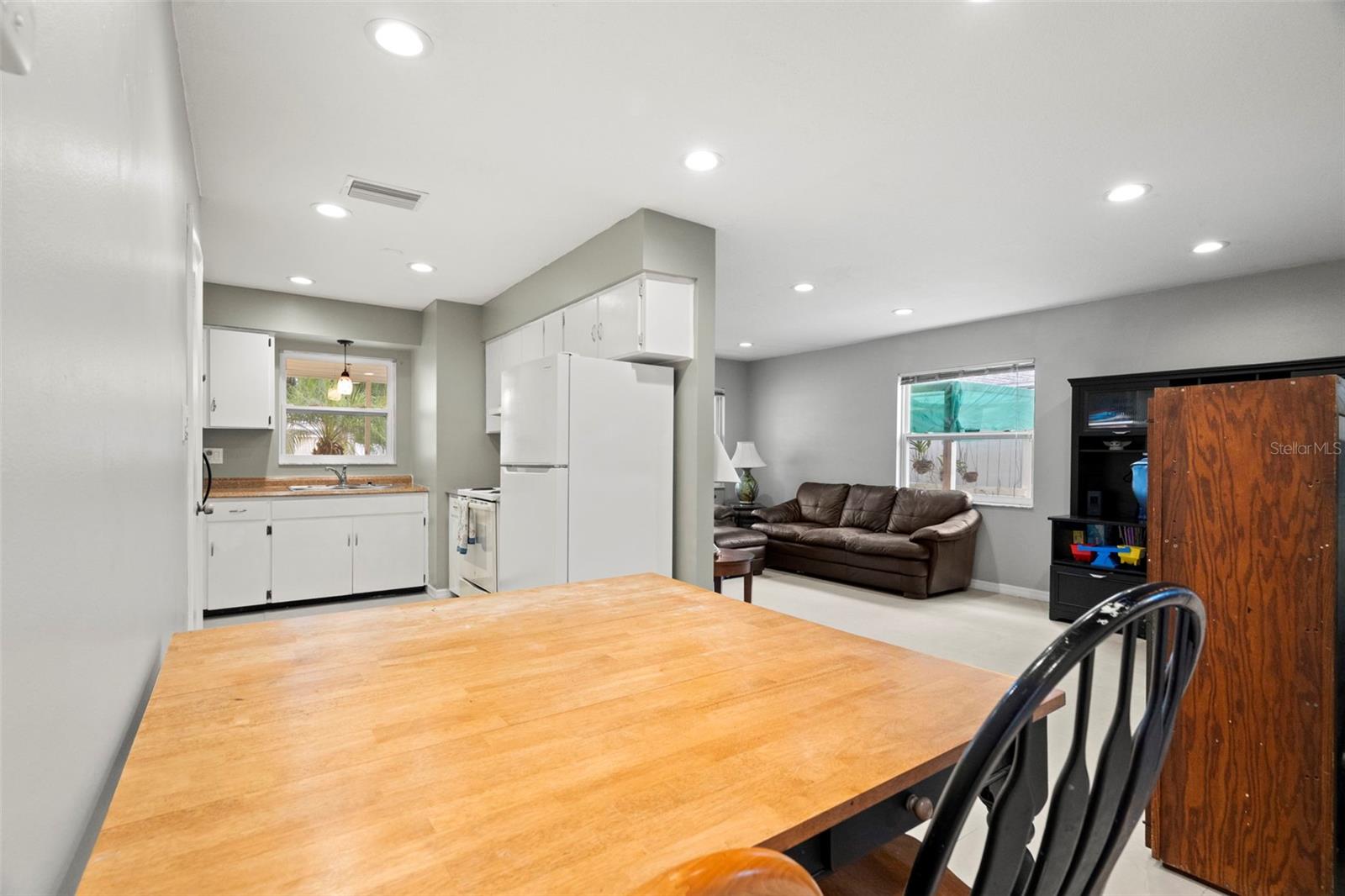 View of U-shaped living room, dining area, kitchen