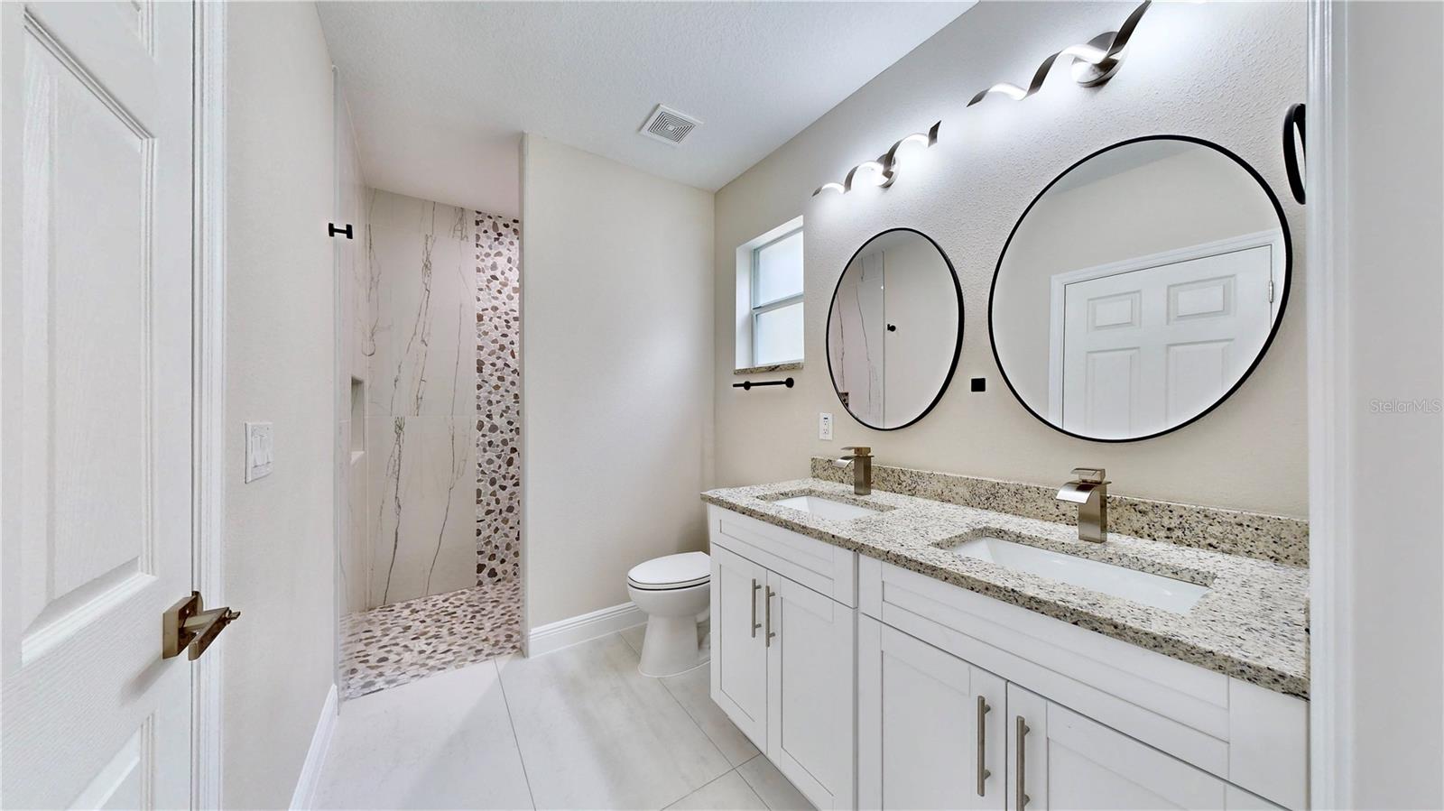 Primary bathroom with Double vanity and Walk in Shower