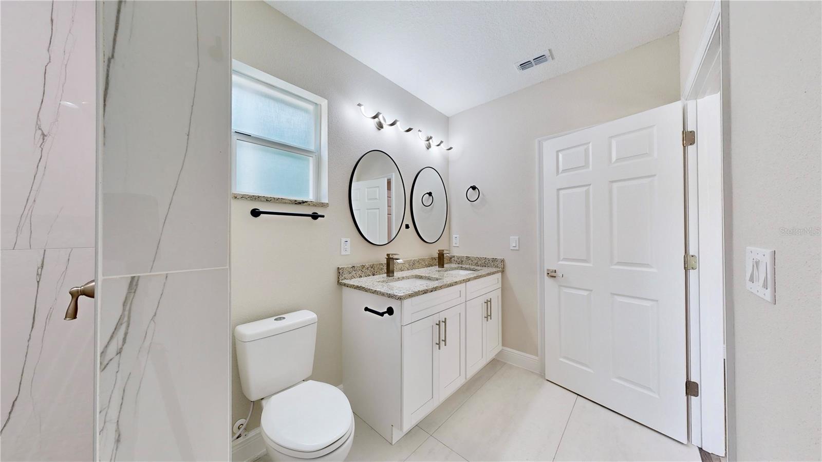 Primary bathroom with Double vanity and Walk in Shower