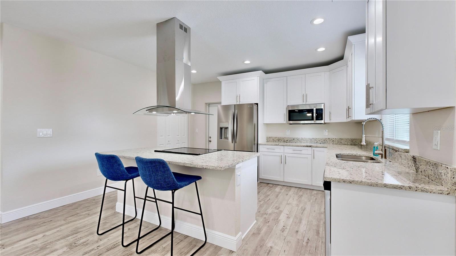 Open Kitchen with Granite Countertops, Stainless Steel Appliances and Pantry