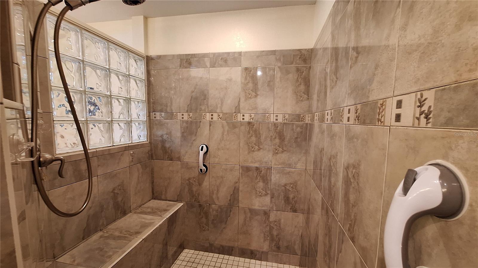 Tiled walk-in shower & bench