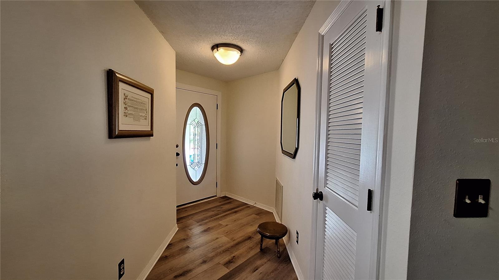 Wide entryway with coat closet