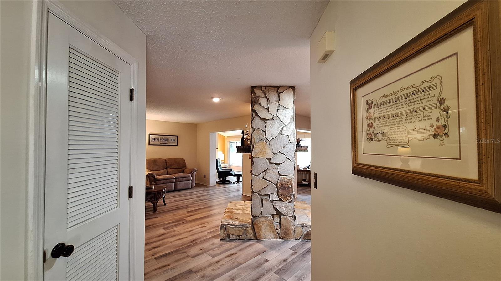 Upon entering you're greeted by the wood burning double sided stone fireplace