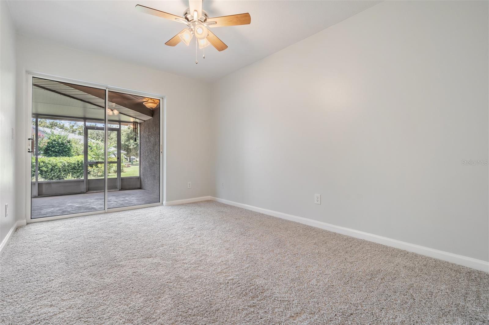 Guest bedroom with access to screened lanai