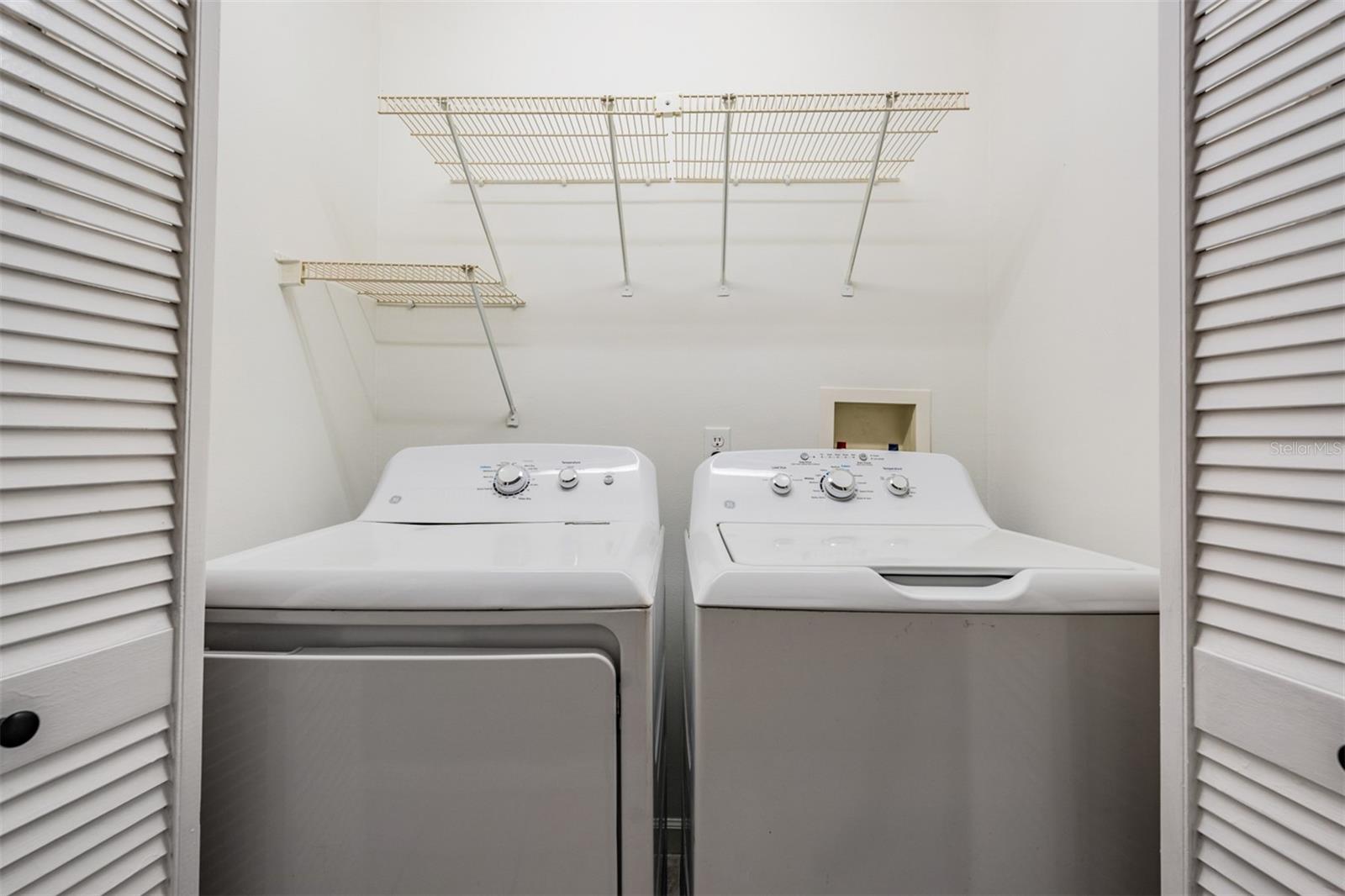 utility closet with 2017 washer/dryer