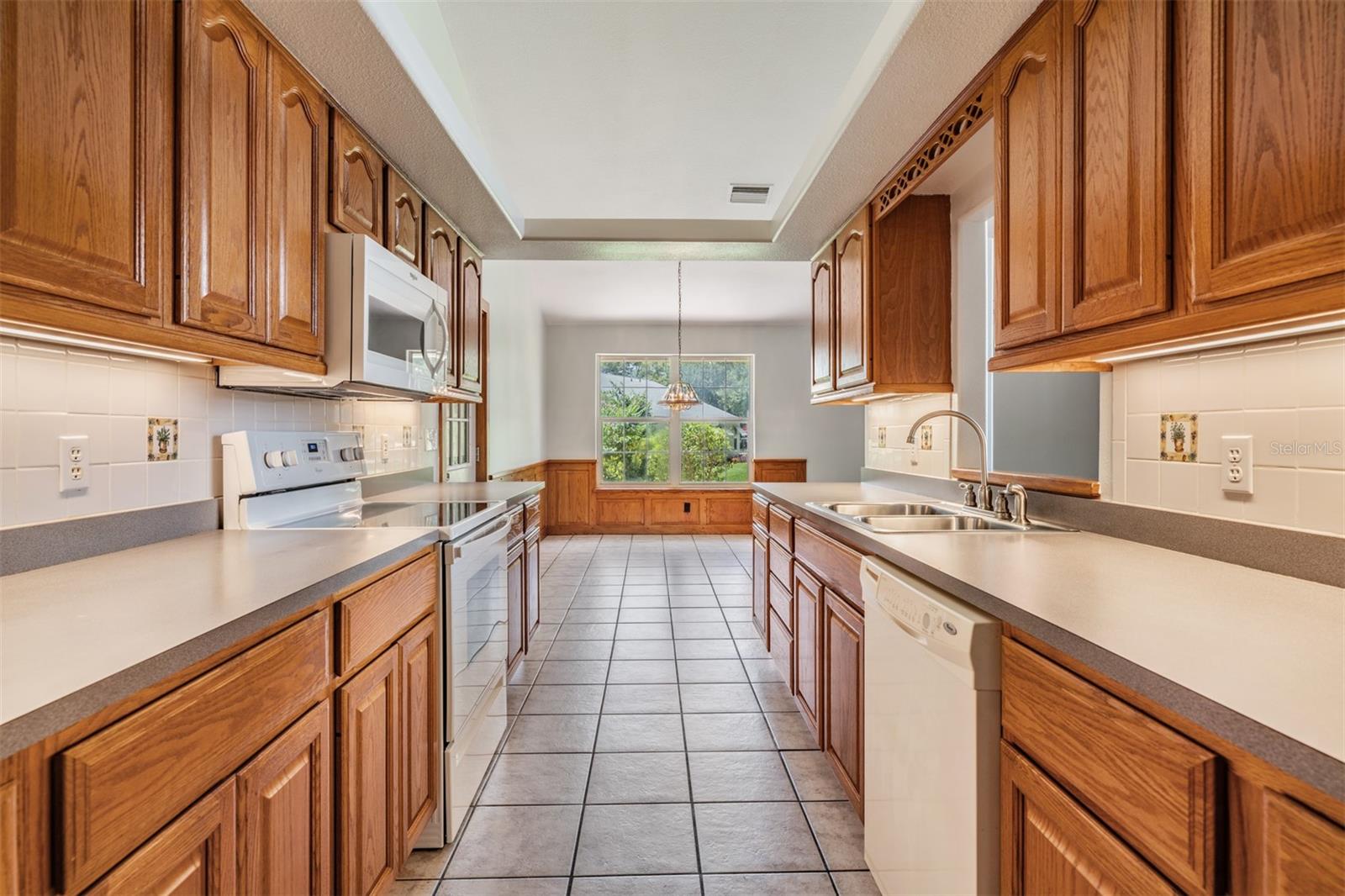 Solid wood cabinets in this Galley kitchen.