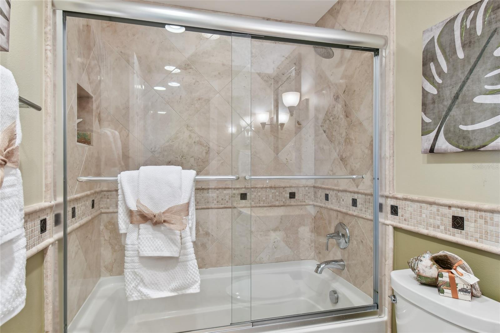 Glass enclosed shower add to the beauty