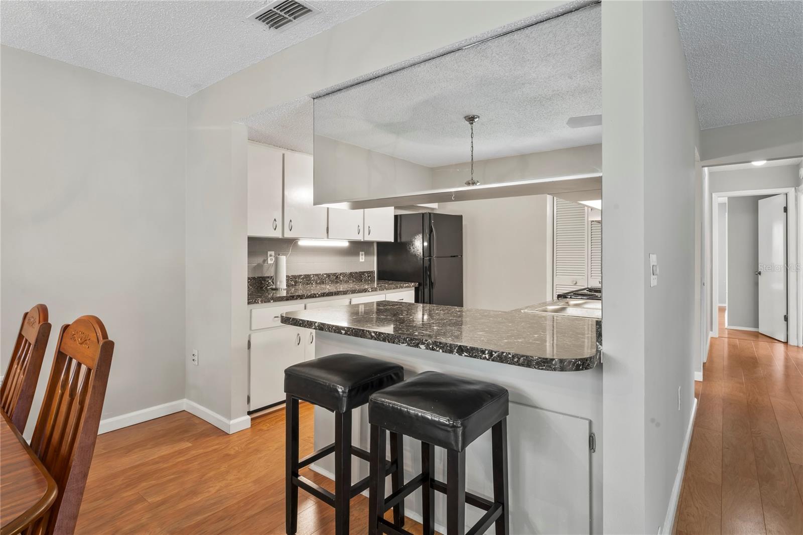 Breakfast bar included two stools.