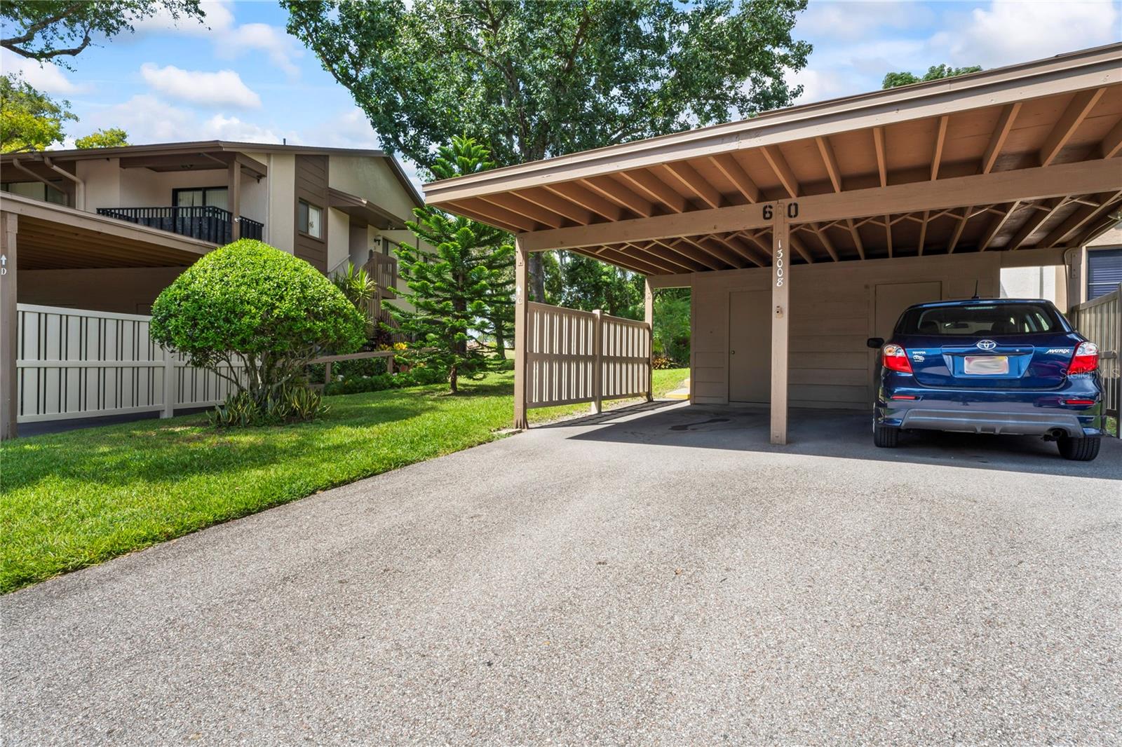 Private carport (on the left side) storage shed included.