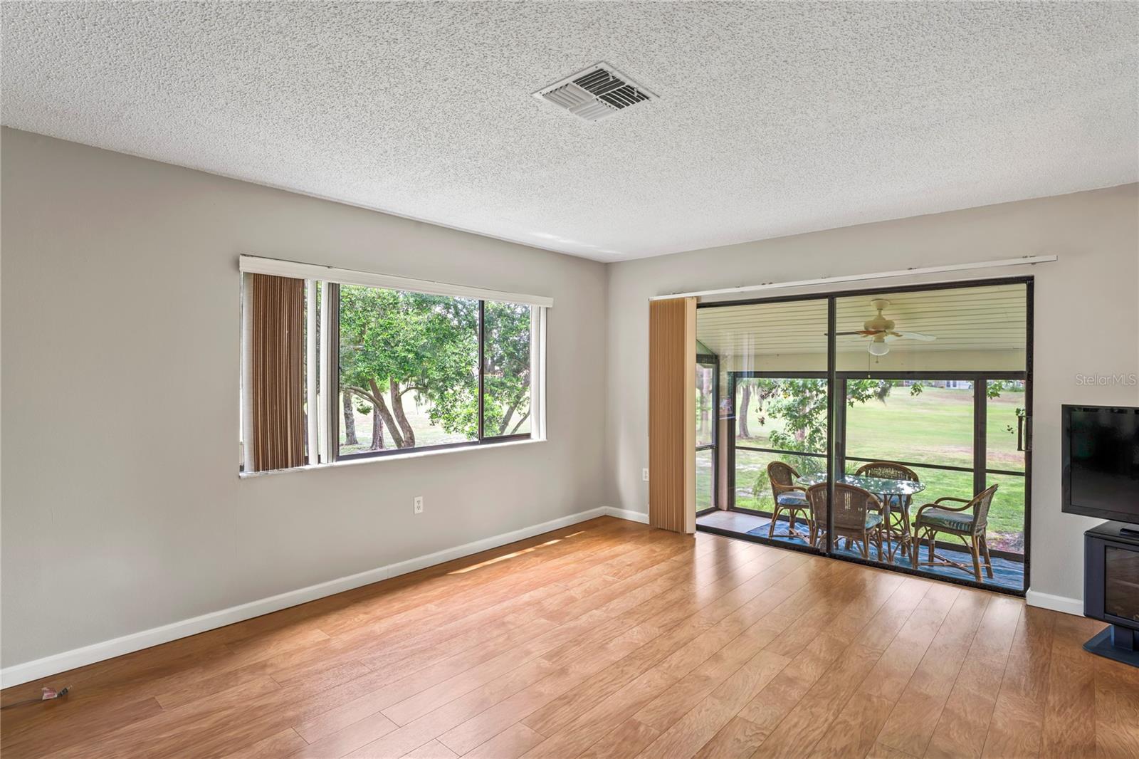 Rear screened balcony overlooking the golf course.