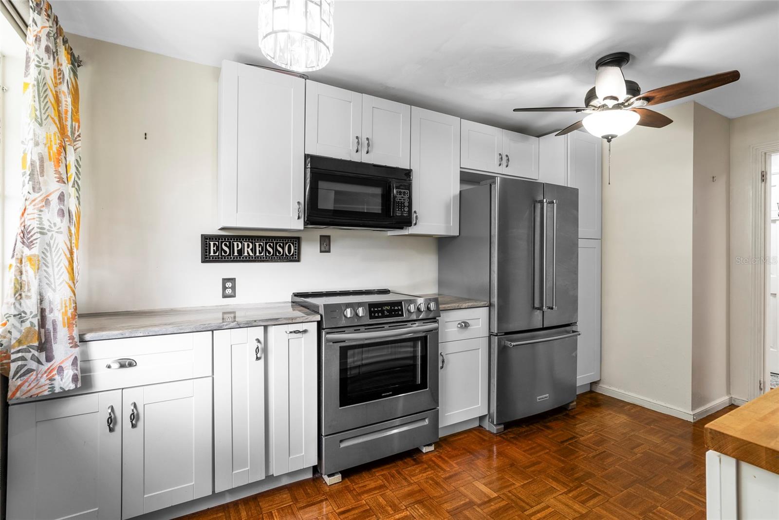 Kitchen with new cabinets, counters and appliances.