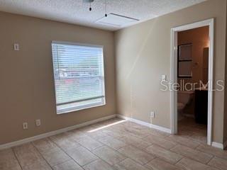 cozy primary bedroom with en- suite