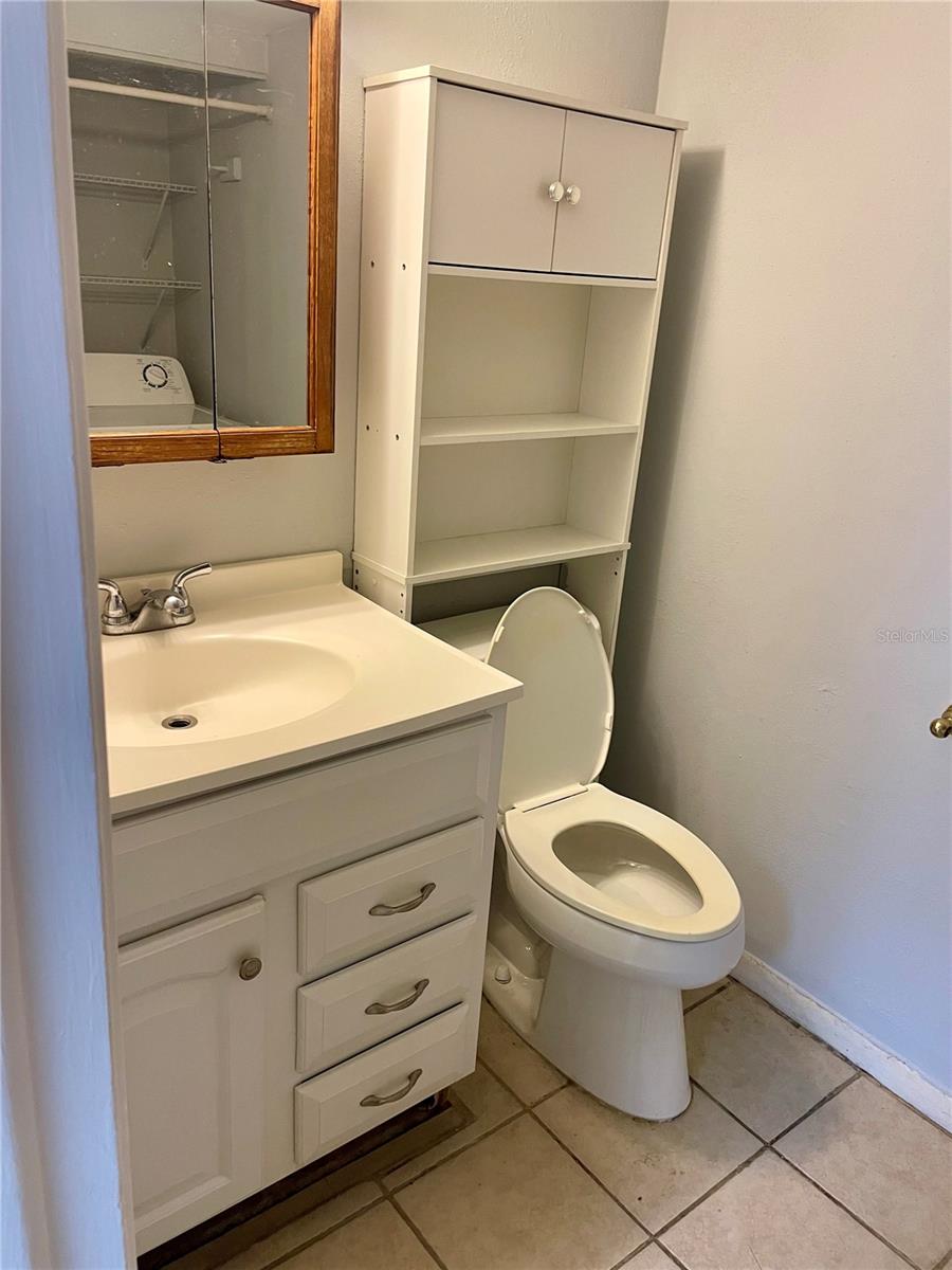 Half bath with laundry on  mail floor off kitchen