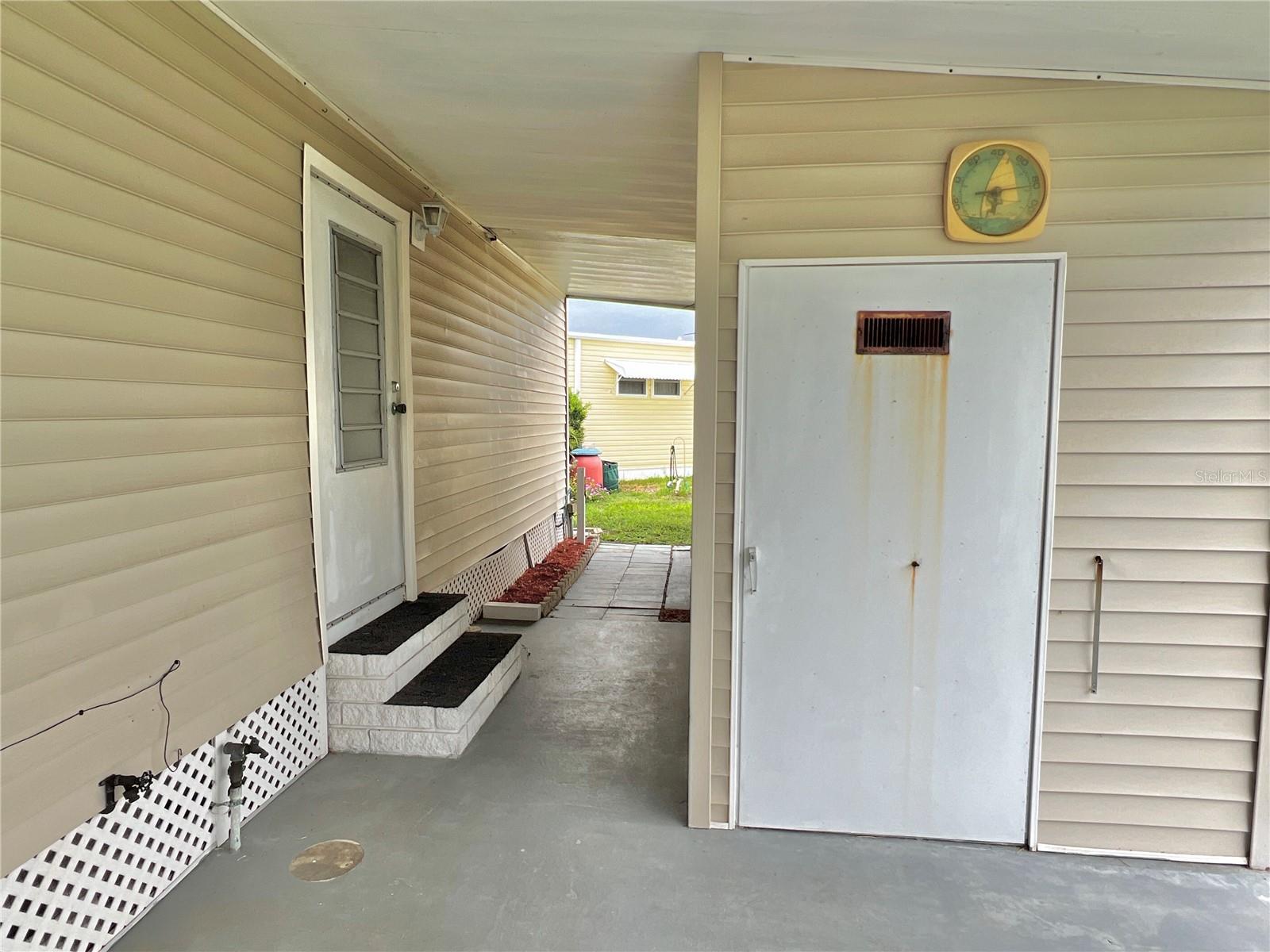 carport and shed appear in good condition after storms.