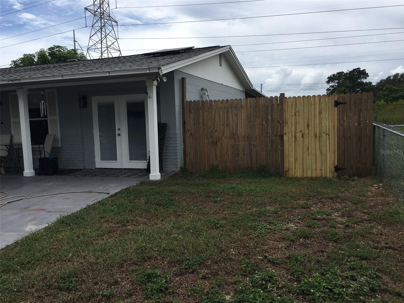 Front of house showing gate access to backyard