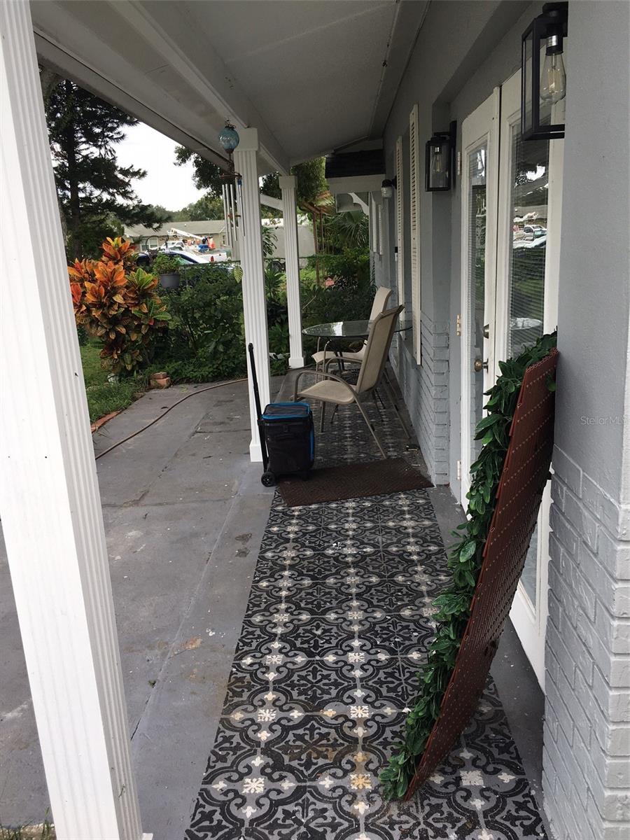 Front Porch view of sitting area with table