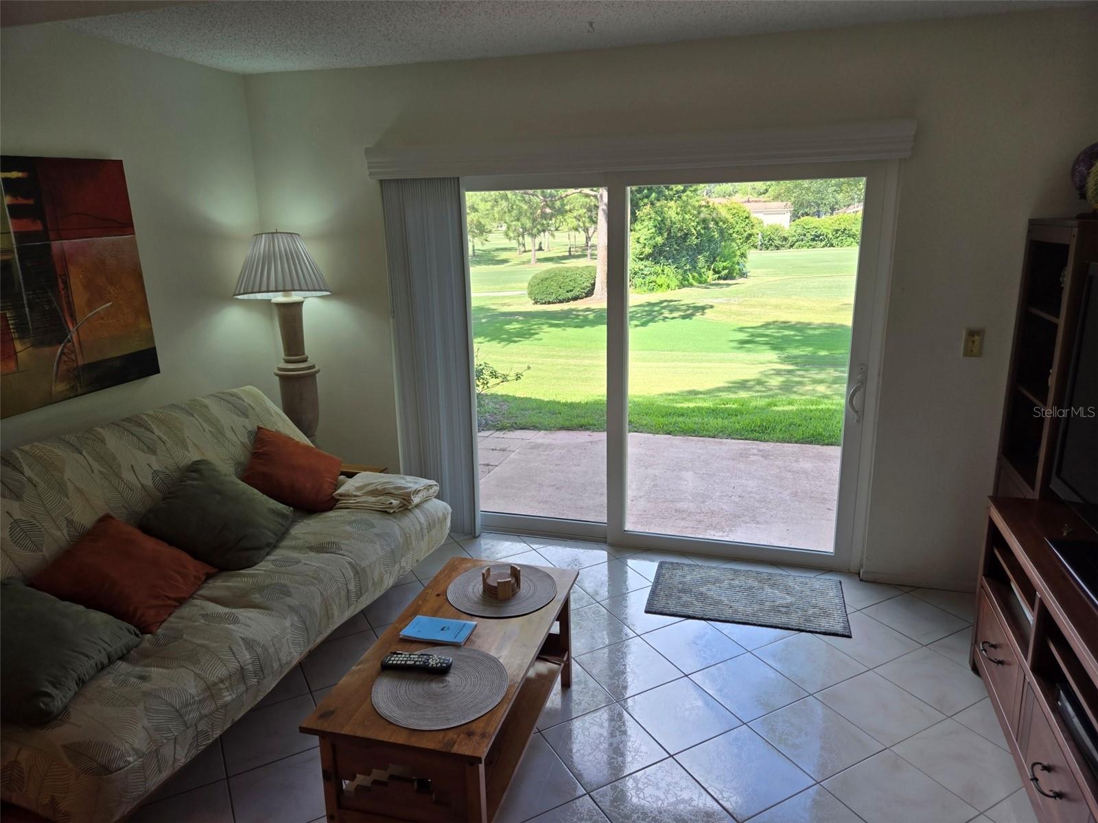 Florida room with view of golf course